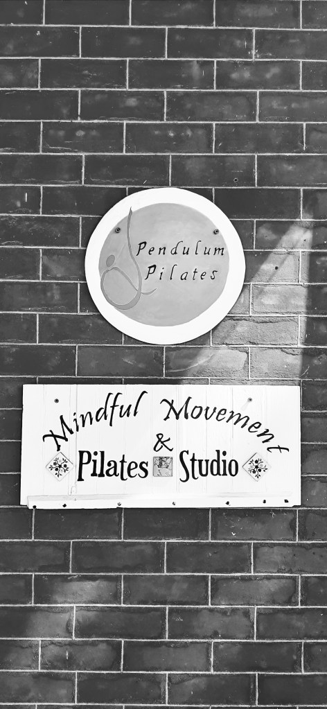 A picture of the signage at the front entrance to Pendulum Pilates