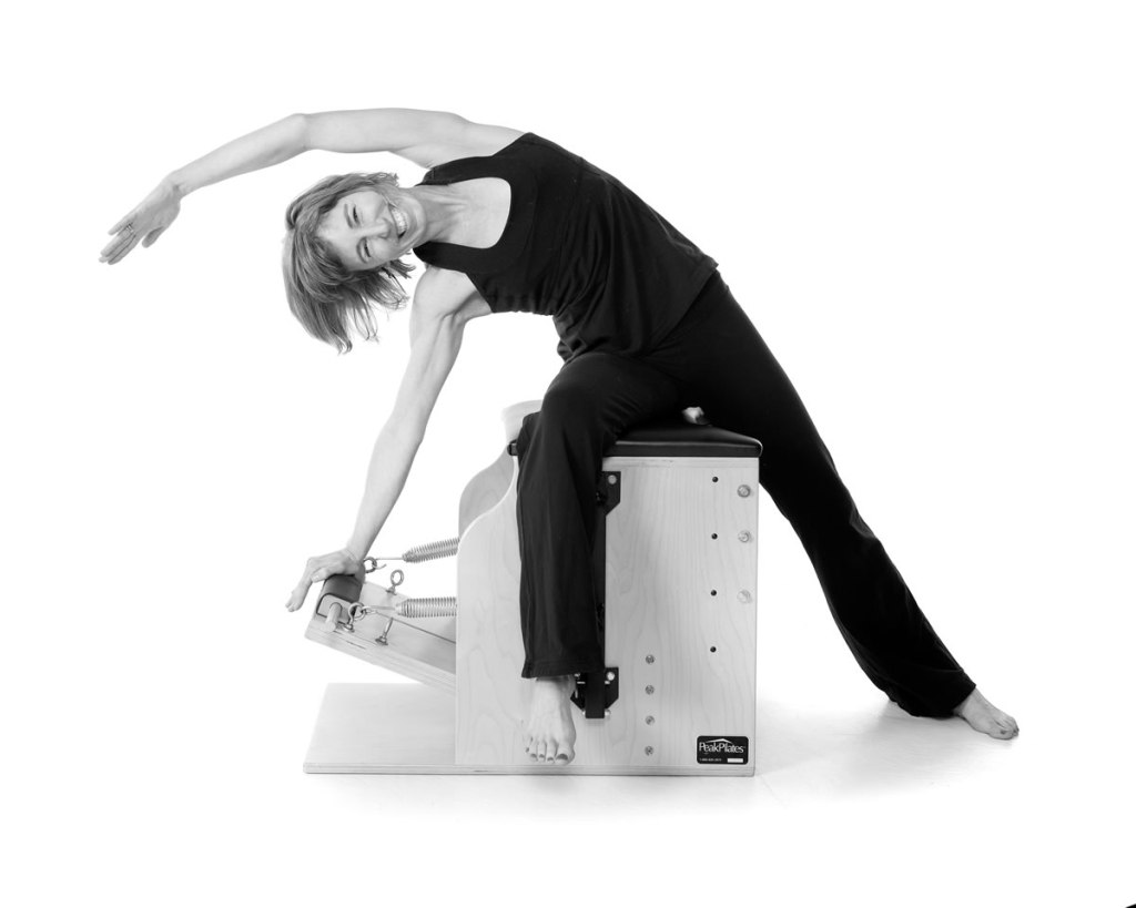 Robyn demonstrating a movement in Pilates.